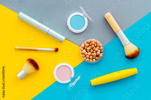 Beauty cosmetics and makeup products on colorful background. Flat lay, top view