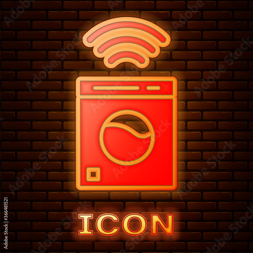 Glowing neon Smart washer system icon isolated on brick wall background. Washing machine icon. Internet of things concept with wireless connection. Vector.