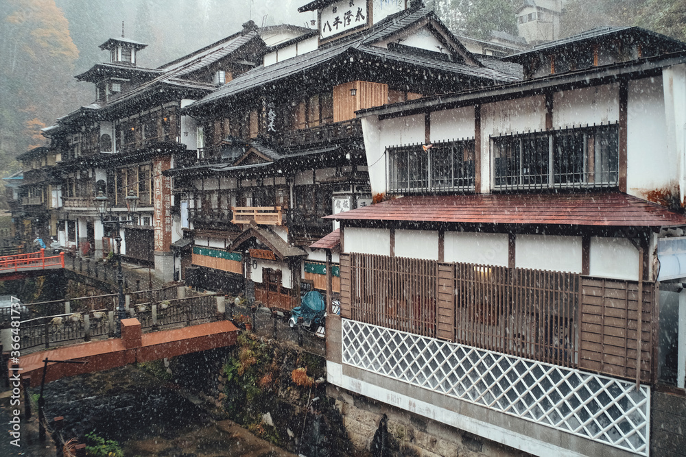 Yamagata, Japan - Nov 16, 2017: Ginzan Onsen first snow of Japanese famous hot spring town in Obanazawa City, Yamagata, Japan. Yamagata, Japan - Nov 16, 2017: Ginzan Onsen first snow of Japanese famous hot spring town in Obanazawa City, Yamagata, Japan.