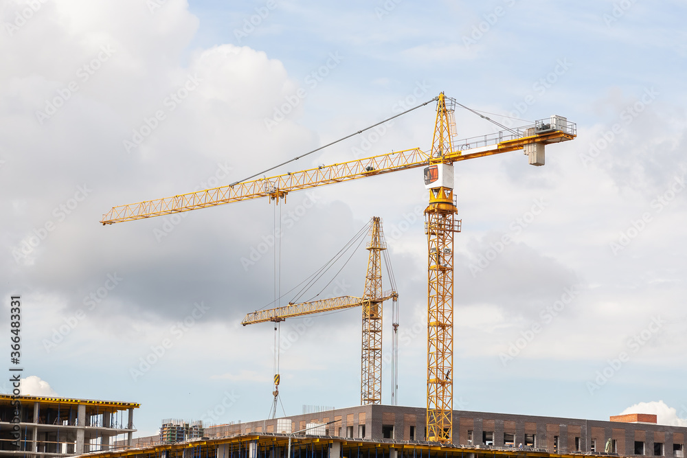 Group of tower crane on the construction of an apartment building. Construction site