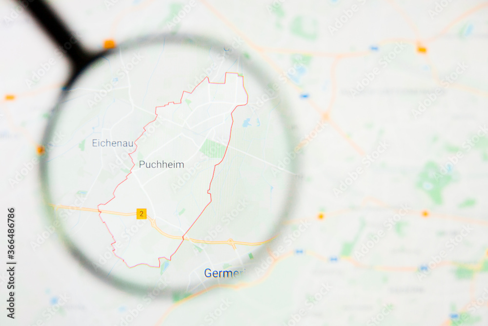 Puchheim city in Germany, Bavaria visualization illustrative concept on display screen through magnifying glass