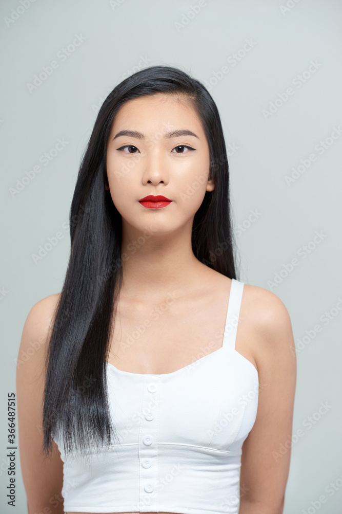 portrait of a beautiful asian girl with a serious face portrait of a beautiful asian girl with a serious face