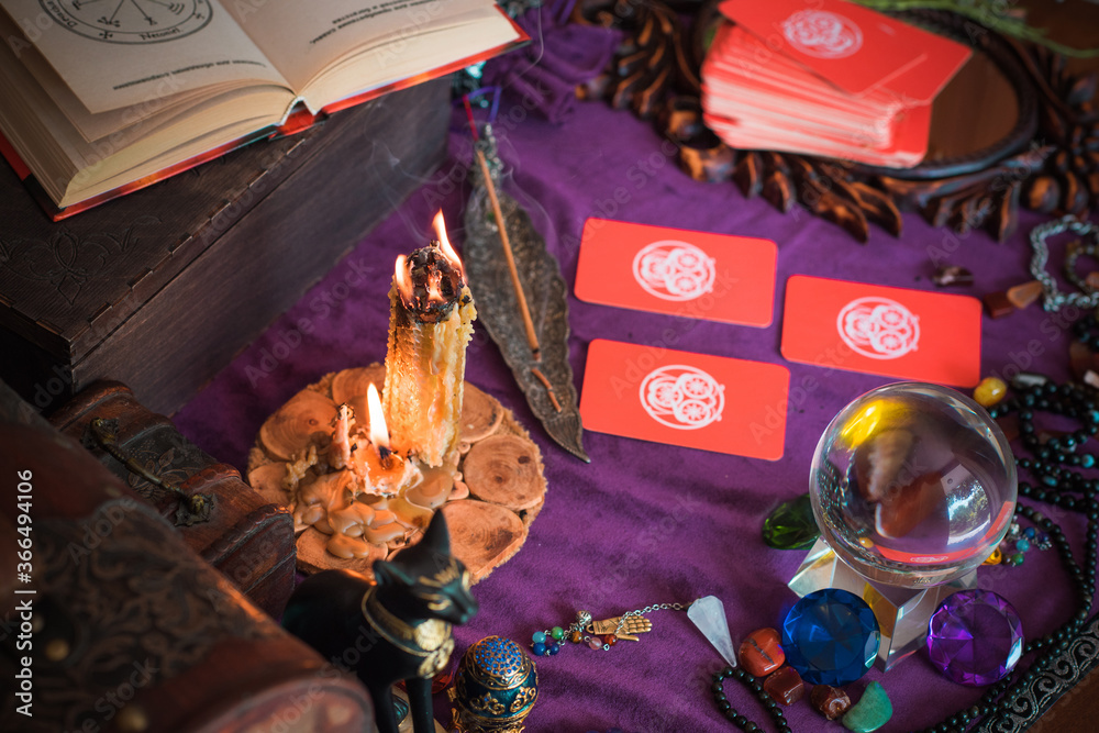 Fototapeta premium Tarot cards, Concept of fortune telling and predictions, magical rituals and wicca elements on a table