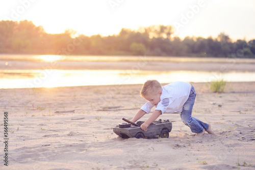 Child have fun on the summer beach.