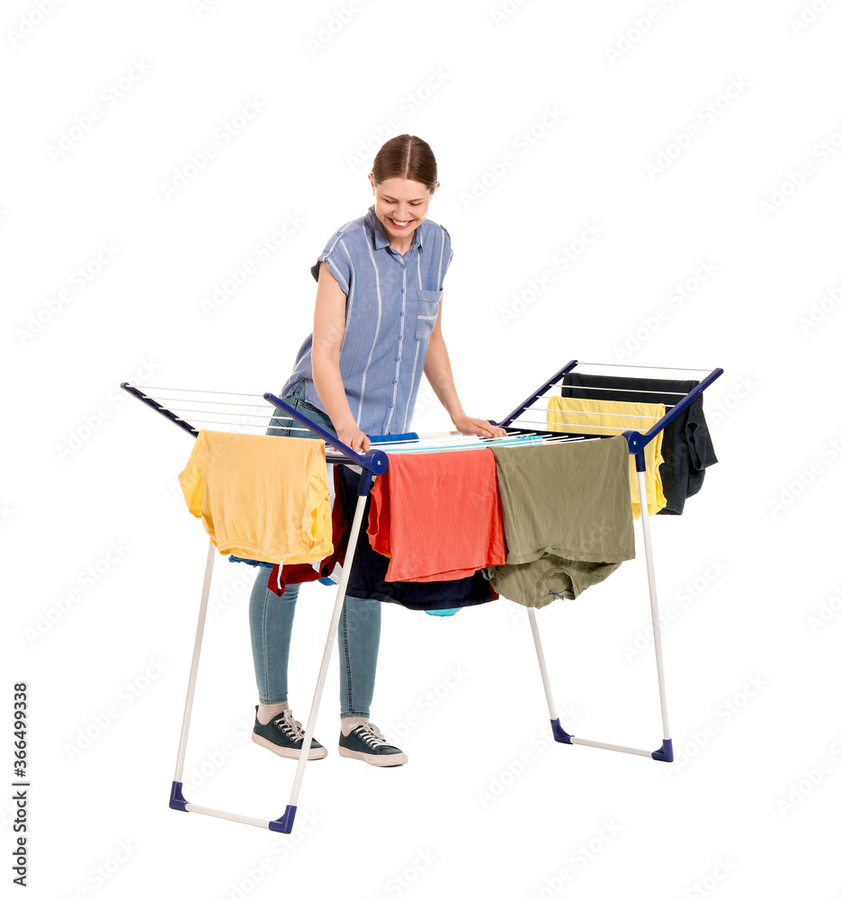 Woman hanging clean clothes on dryer against white background Woman hanging clean clothes on dryer against white background