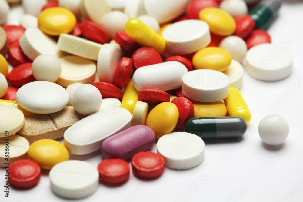 Different colorful tablets at white background Different colorful tablets at white background