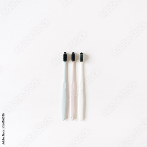 Toothbrushes on white background. Flat lay  top view oral care  dental hygiene concept.