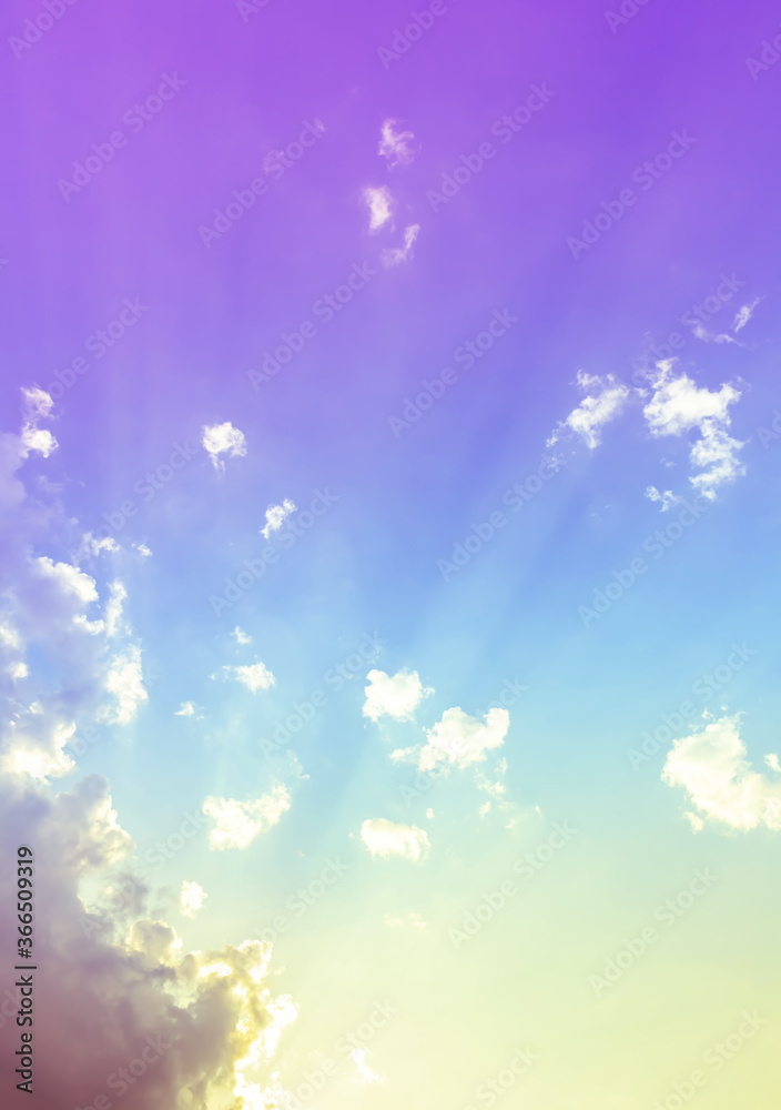 sky and clouds nature background,sun rays light on purple blue sky with green and yellow color light with clouds