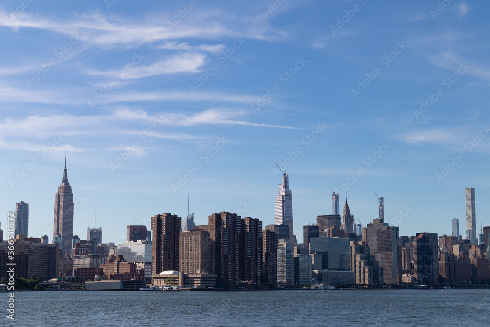 Midtown Manhattan Skyline along the East River with Tall Skyscrapers in New York City
