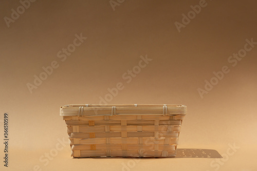 empty wicker basket for your product  on a beige background. Mock up