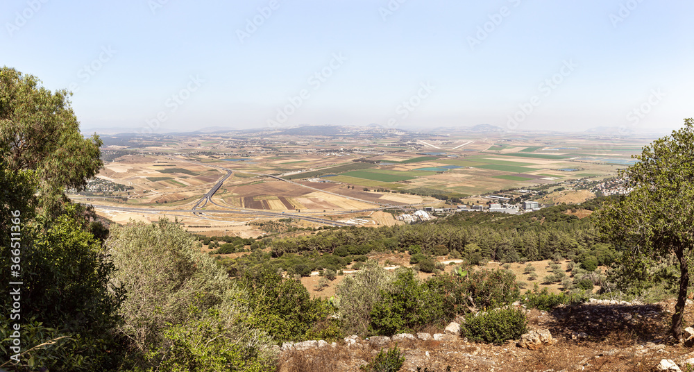 A view  from the roof of a Deir Al-Mukhraqa Carmelite Monastery on the adjacent valley with roads, settlements and fields in northern Israel