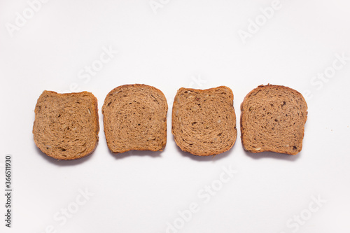 Assortment of baked bread on white background