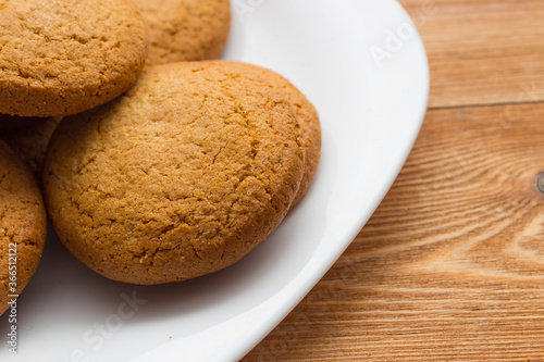 Homemade oatmeal cookie on the wooden background