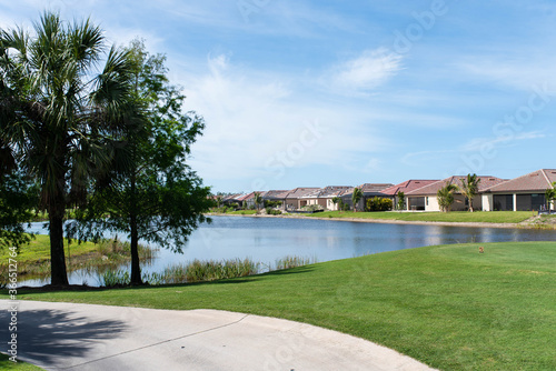 Golf course pond in South Florida retirement community. Alligators frequently rest on the shores and are seen in the neighborhood.