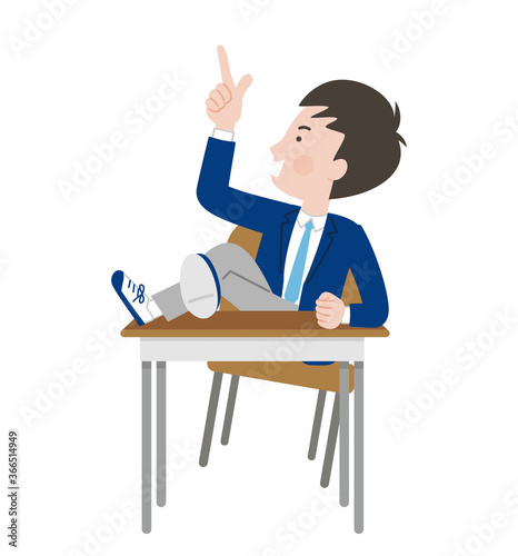 机に足をのせる態度の悪い男子学生