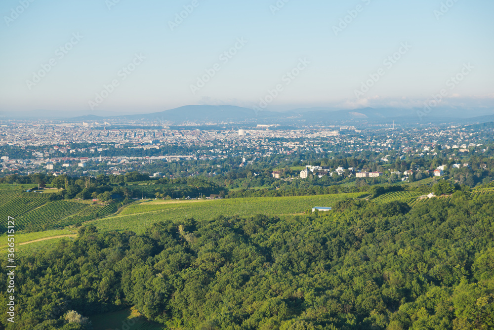 Scenic view from Leopoldsberg over the hills of Vienna Woods and the city in the morning.