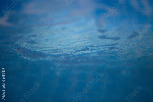 bubbles from the jet of water in the blue pool filter works