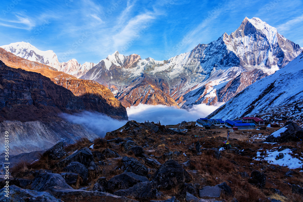 Panorama of Mount Machapuchare (Fishtail) at sunset, view from Annapurna base camp in the Nepal Himalaya. Machhapuchchare is a mountain in the Annapurna Himal of north Central Nepal