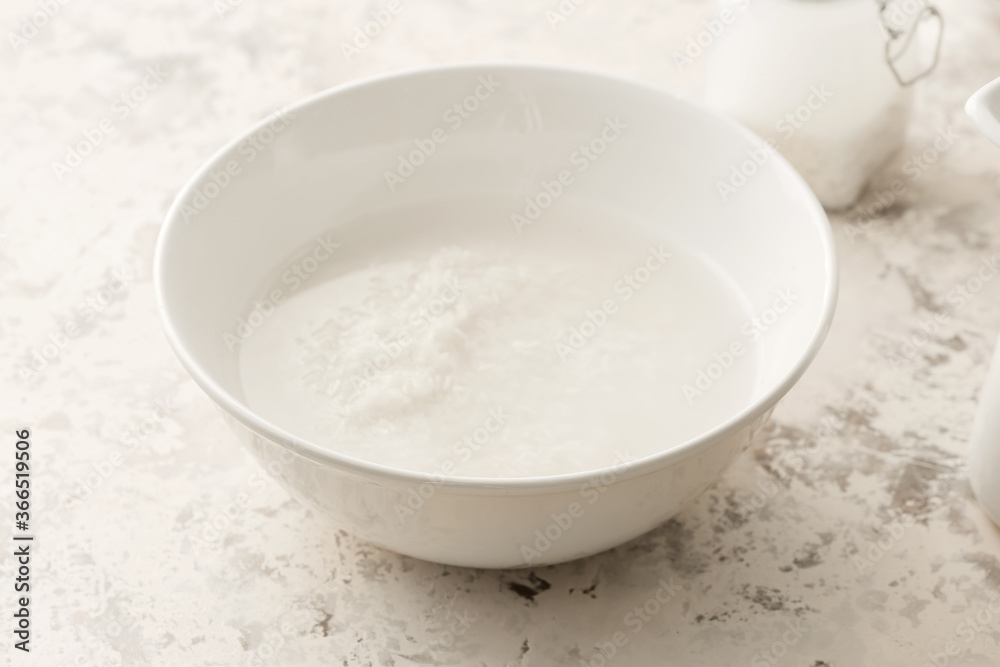 Bowl of rice water on light background Bowl of rice water on light background