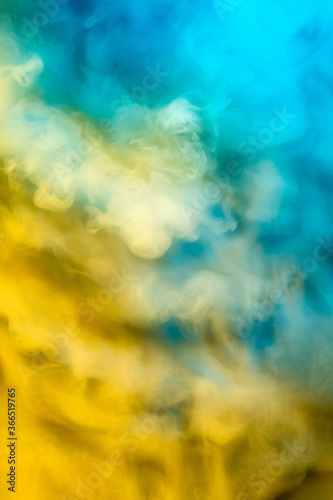 Abstract colorful  multicolored smoke spreading  bright background for advertising or design  wallpaper for gadget. Neon lighted smoke texture  blowing clouds. Modern designed.