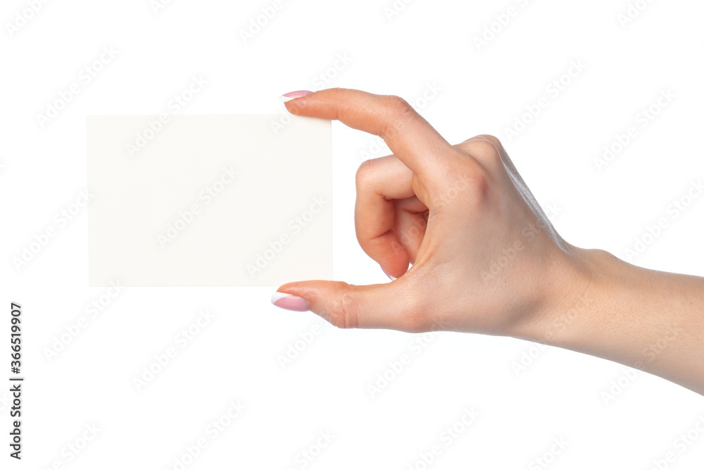 Obraz premium Woman's hand with blank white business card isolated on white