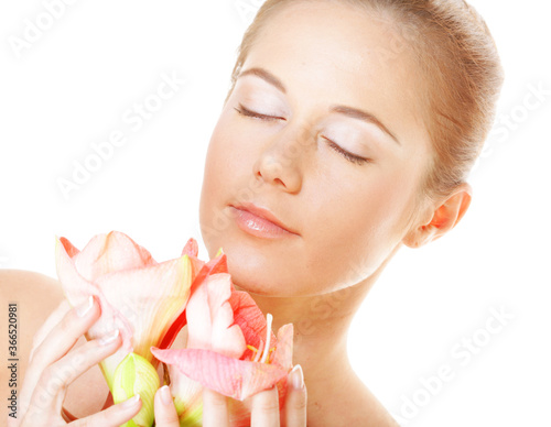 girl with cloused eyes holding flower photo