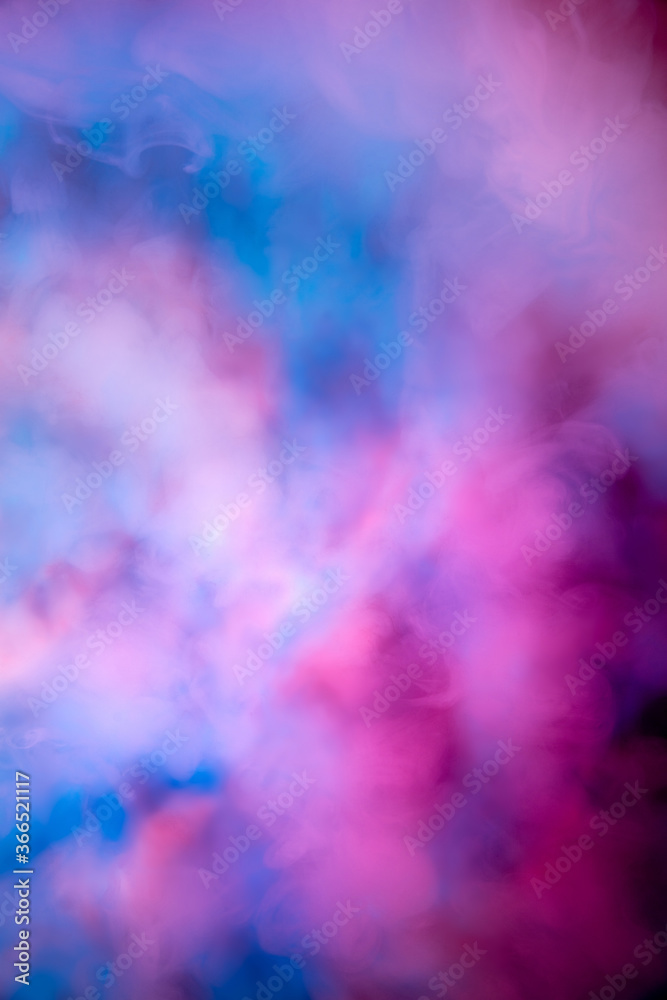 Abstract colorful, multicolored smoke spreading, bright background for advertising or design, wallpaper for gadget. Neon lighted smoke texture, blowing clouds. Modern designed.