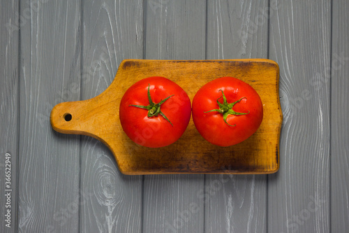 tomatoes on a wooden board