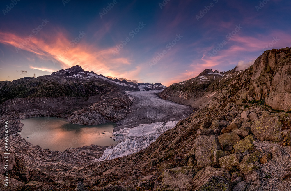dramatic colored clouds at sunset over Rhoneglacier