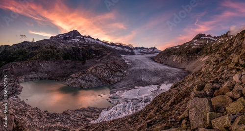 dramatic colored clouds at sunset over Rhoneglacier