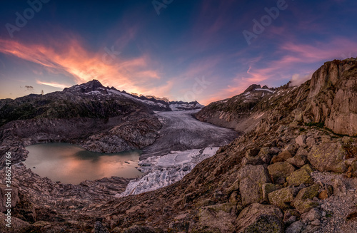 dramatic colored clouds at sunset over Rhoneglacier