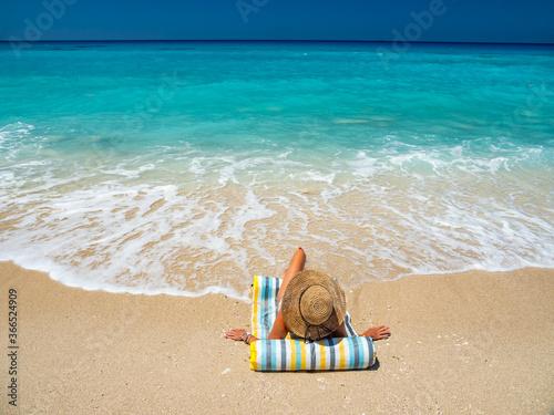Fotografie Woman at the beach in Greece