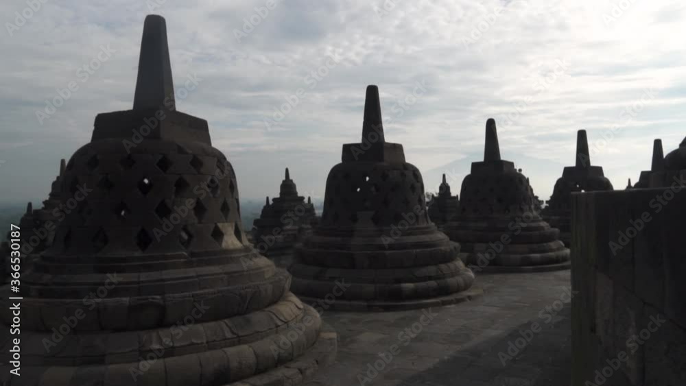 Candi Borobudur - Mahayana Javanese Buddhist Temple UNESCO World Heritage Site - Stupas and Buddha Statue in Yogyakarta Magelang, Central Java, Indonesia Indonesian Candi Borobudur - Mahayana Javanese Buddhist Temple UNESCO World Heritage Site - Stupas and Buddha Statue in Yogyakarta Magelang, Central Java, Indonesia Indonesian