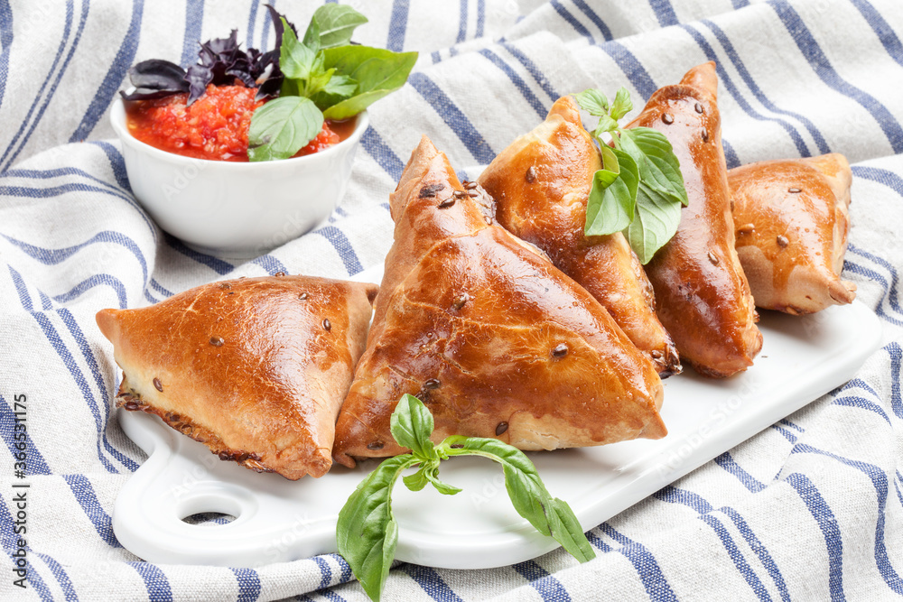 Delicious samosa on a tablecloth background Delicious samosa on a tablecloth background