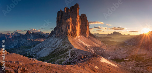 Dolomites, Three Peaks of Lavaredo. Panoramic image of Italian  Dolomites with famous Three Peaks of Lavaredo (Tre Cime di Lavaredo) South Tyrol, Italy, Europe at summer sunset.