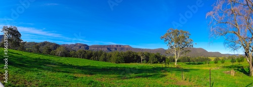 Panorama southern highlands Kangaroo Valley and Berry country town lush green pastures blue skies photo