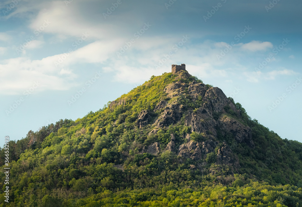 Beautiful evening light on ruins of Kostalov castle, Trebenice, Czech central mountains
