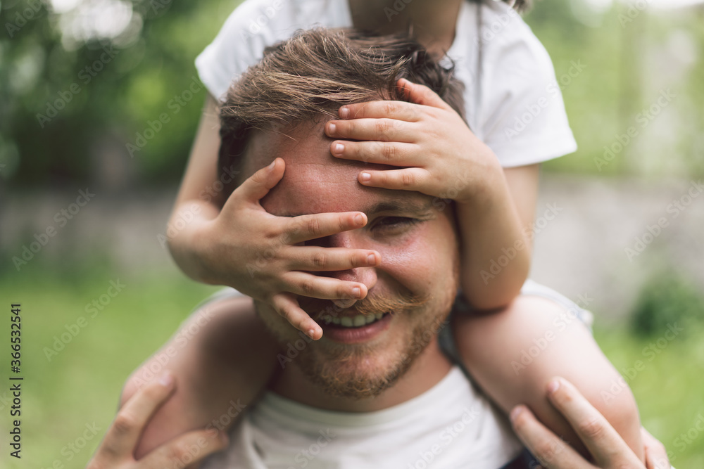 Father and his son playing and hugging in outdoors. Concept of Father's day. Father and his son playing and hugging in outdoors. Concept of Father's day.