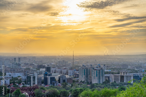 Almaty city at sunset from a height. Impressive view.
