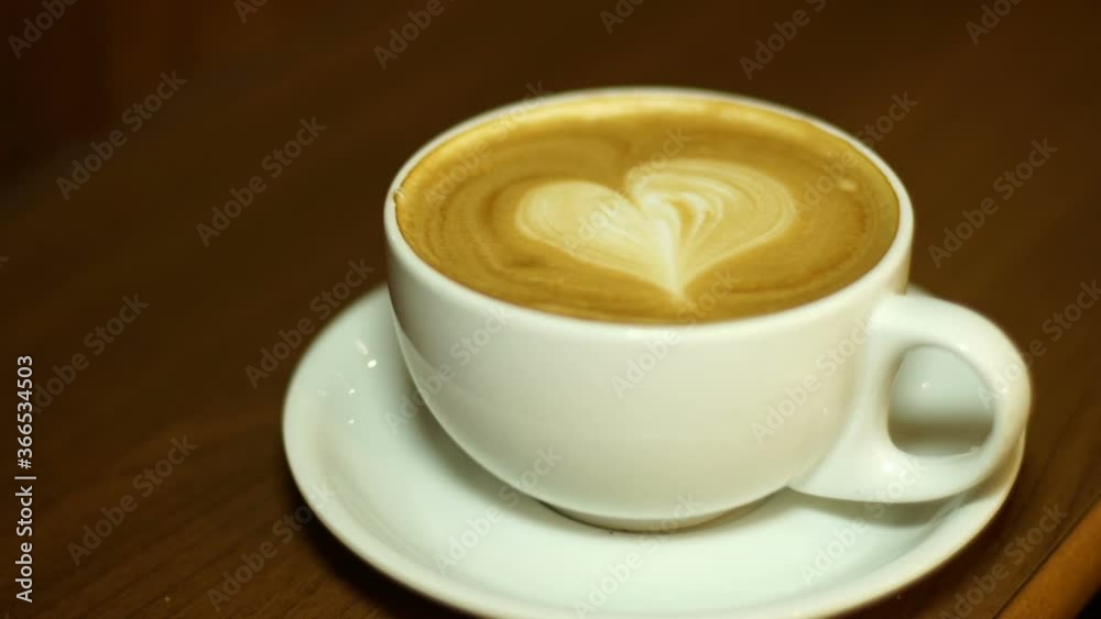 Coffee Cup with heart shape on top. Large Cappuccino with frothy milk. Stock Video Clip Footage Coffee Cup with heart shape on top. Large Cappuccino with frothy milk. Stock Video Clip Footage