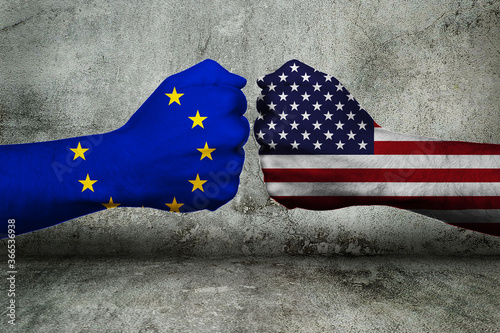 Obraz na płótnie Concept of the Conflict (Trade) between the European Union and the United States of America with two opposing fists in front of a wall w salonie