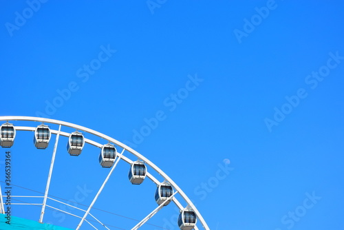 The Ferris wheel against a blue sky and moon at the resort of Scheveningen  The Hague  in the Netherlands. Europe s first Ferris Wheel over the Sea