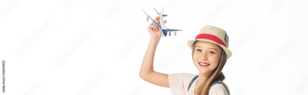 cheerful girl in hat with plane model isolated on white, panoramic shot cheerful girl in hat with plane model isolated on white, panoramic shot