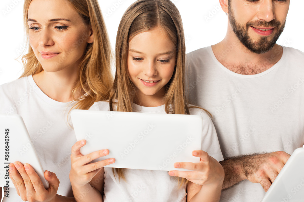smiling family in white t-shirts using digital tablets isolated on white smiling family in white t-shirts using digital tablets isolated on white