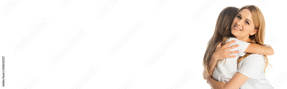 happy mother hugging daughter isolated on white, panoramic shot happy mother hugging daughter isolated on white, panoramic shot