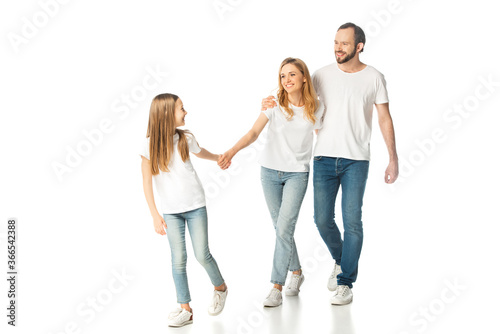 happy casual family holding hands while walking isolated on white