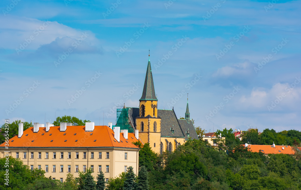 Fototapeta premium The first public maternity hospital. Church of st. Apollinaria extends along the Prague hill of the Winds, located in the New Town.