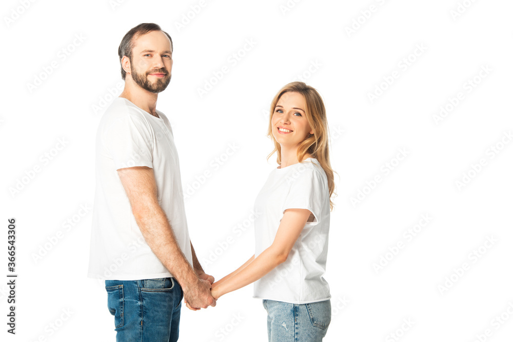side view of adult couple in white t-shirts holding hands isolated on white side view of adult couple in white t-shirts holding hands isolated on white