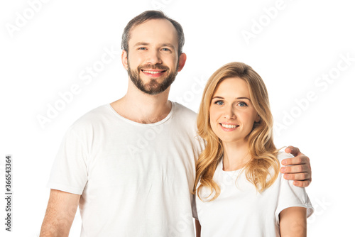 happy adult couple in white t-shirts embracing isolated on white