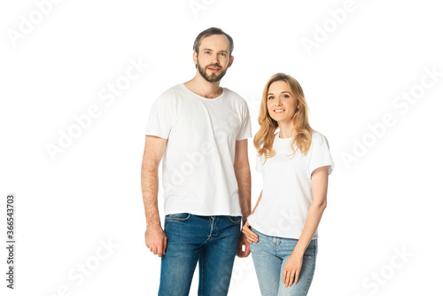 adult couple in white t-shirts and jeans posing isolated on white